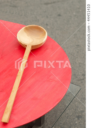 Handmade brown wooden spoon at fair. Russia. Handmade brown wooden spoon at fair. Russia. 44451410
