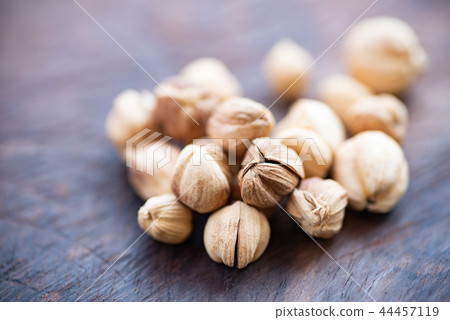 White cardamon on wooden background,herb and spice White cardamon on wooden background,herb and spice 44457119