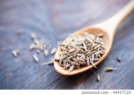 Caraway seeds on wooden spoon, herb and spice Caraway seeds on wooden spoon, herb and spice 44457120