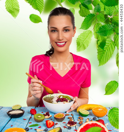 Smoothie bowl with happy young woman. Smoothie bowl with happy young woman. 44458430