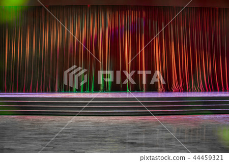 Red curtains and wooden stage. 44459321