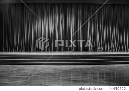 Black and white curtains and wooden stage. 44459322