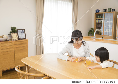 3 year old girl and mom drinking juice 3 year old girl and mom drinking juice 44459494