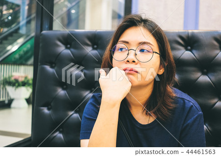 Close up of young Asian woman in the restaurant. Close up of young Asian woman in the restaurant. 44461563
