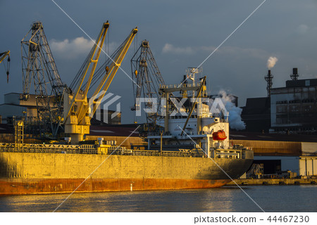 Carrier ship lit by morning glow Carrier ship lit by morning glow 44467230