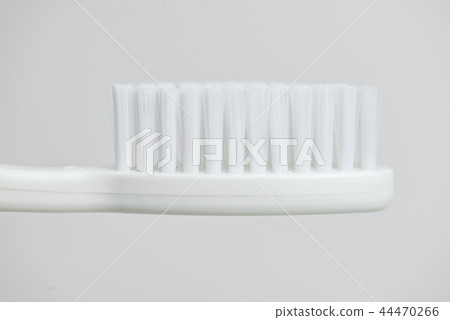 Close up on white toothbrush Close up on white toothbrush 44470266