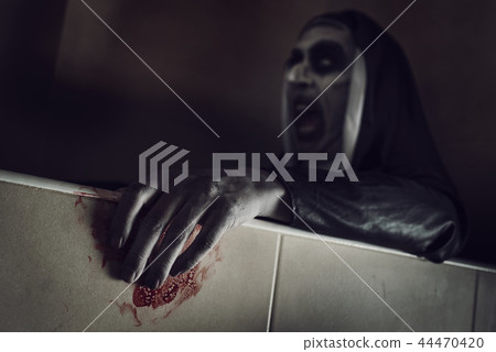 frightening evil nun with blood in her hands frightening evil nun with blood in her hands 44470420