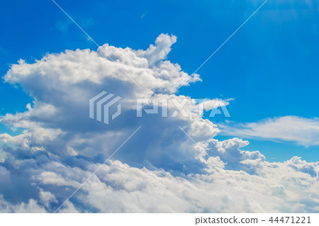 Big Cumulus Cloud in Sunlight Background 44471221