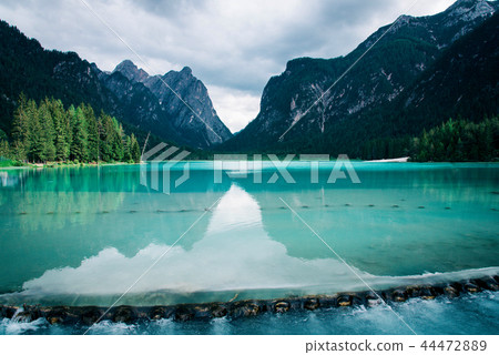 Dobbiaco Lake in the Dolomites Alps, Italy. Dobbiaco Lake in the Dolomites Alps, Italy. 44472889