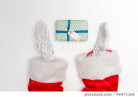 Santa holding a Christmas gift 44473100