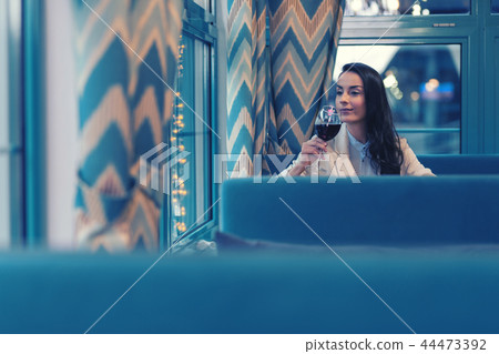 Attractive female person drinking tasty red wine Attractive female person drinking tasty red wine 44473392