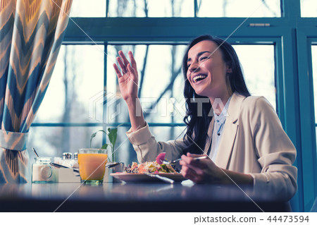 Happy female person laughing at funny joke 44473594