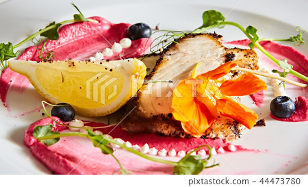 White fish with lemon on white plate, selective focus 44473780