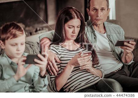 Attentive male person looking straight at camera 44474386