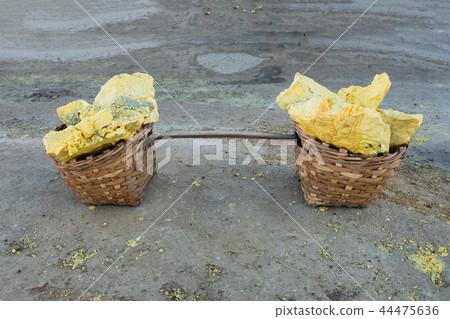 Yellow Sulphur cracked piece on wooden basket Yellow Sulphur cracked piece on wooden basket 44475636