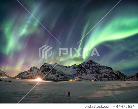 Fantastic Aurora borealis over snowy mountain 44475684