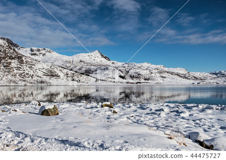 Snowy mountain reflection on arctic ocean Snowy mountain reflection on arctic ocean 44475727