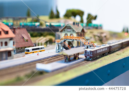 Toy railway with train and station 44475728