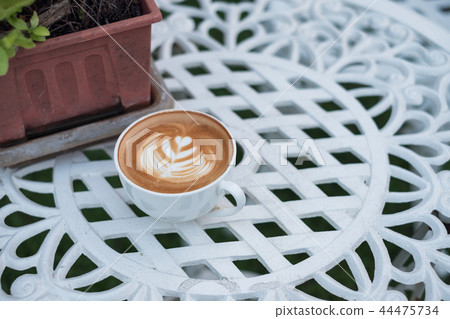 Coffee hot latte with flower shape in white cup 44475734