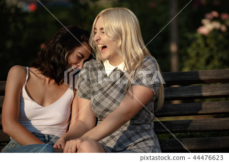Lesbian couple together outdoors 44476623