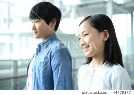 Male and female elementary school students Male and female elementary school students 44478377