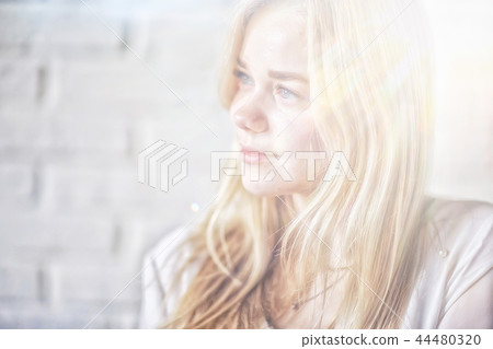 young blonde long hair / portrait of a young adult beauty with long blond hair 44480320