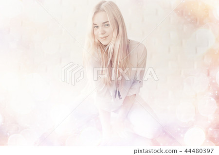 cute blond young adult / portrait of an adult beautiful girl model with blond hair in a happy image cute blond young adult / portrait of an adult beautiful girl model with blond hair in a happy image 44480397