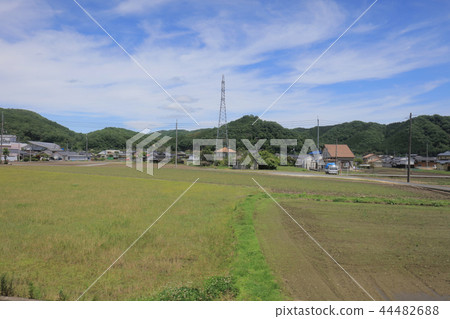 a View through tram window of the country side a View through tram window of the country side 44482688