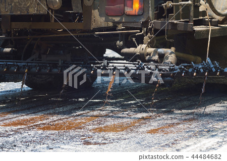 Truck dropping asphalt in roadwork site Truck dropping asphalt in roadwork site 44484682