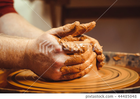 Potter makes a jug Potter makes a jug 44485048