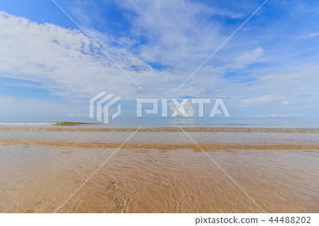 Sea sand sky and soft wave of blue ocean Sea sand sky and soft wave of blue ocean 44488202