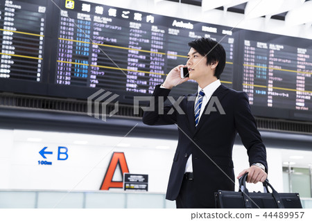 Business airport smartphone businessman return business trip Business airport smartphone businessman return business trip 44489957