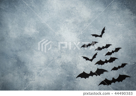 Halloween concept. black paper bats on grey backgr 44490383