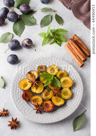 Fresh berries plums in the context of cooking  44490453