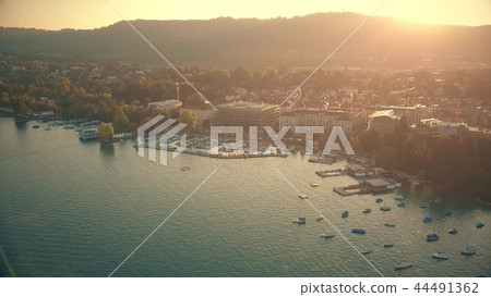 Aerial view of sunlit Zurich cityscape in evening, Switzerland Aerial view of sunlit Zurich cityscape in evening, Switzerland 44491362