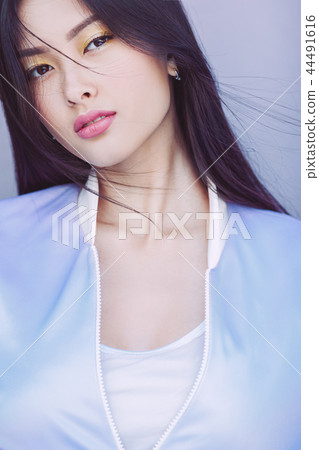 Asian fashion model outdoors 44491616