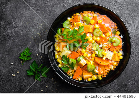 Healthy vegetarian vegetable soup with lentil Healthy vegetarian vegetable soup with lentil 44491696