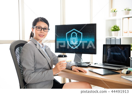 office worker looking at the camera when working 44491913