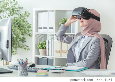 office worker wearing VR technology device office worker wearing VR technology device 44491961