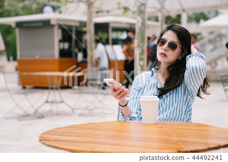 a confident office lady sitting outdoor a confident office lady sitting outdoor 44492241