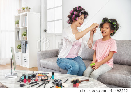 mom help to set daughter's hair curly mom help to set daughter's hair curly 44492362