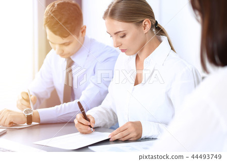 Group of business people or lawyers discussing terms of transaction in office. Meeting and teamwor Group of business people or lawyers discussing terms of transaction in office. Meeting and teamwor 44493749