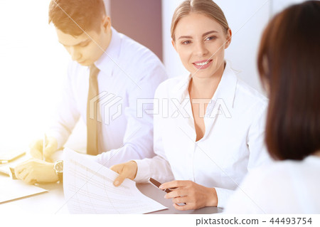 Group of business people or lawyers discussing terms of transaction in office. Meeting and teamwor Group of business people or lawyers discussing terms of transaction in office. Meeting and teamwor 44493754