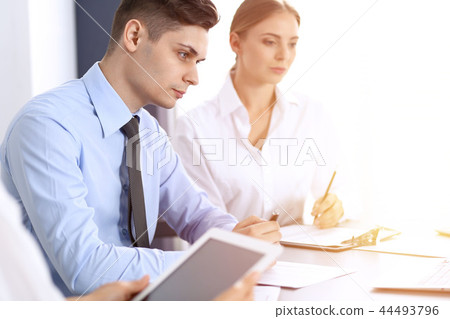 Group of business people or lawyers discussing terms of transaction in office. Meeting and teamwor Group of business people or lawyers discussing terms of transaction in office. Meeting and teamwor 44493796