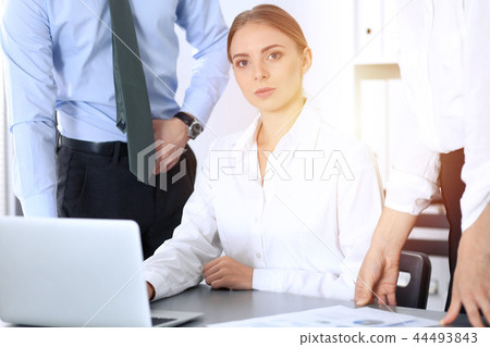 Group of business people using laptop computer in office. Meeting and teamwork concept Group of business people using laptop computer in office. Meeting and teamwork concept 44493843