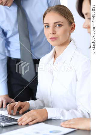 Group of business people using laptop computer in office. Meeting and teamwork concept Group of business people using laptop computer in office. Meeting and teamwork concept 44493855