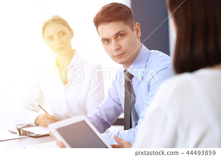 Group of business people or lawyers discussing terms of transaction in office. Meeting and teamwor Group of business people or lawyers discussing terms of transaction in office. Meeting and teamwor 44493859