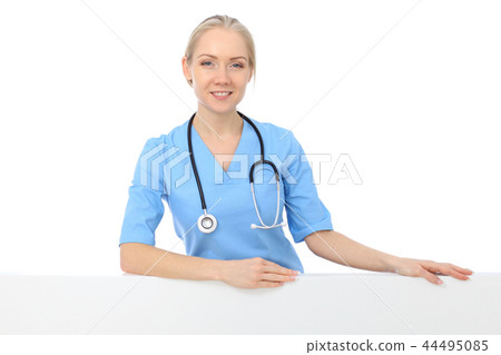 Smiling young nurse portrait isolated over white background.  44495085