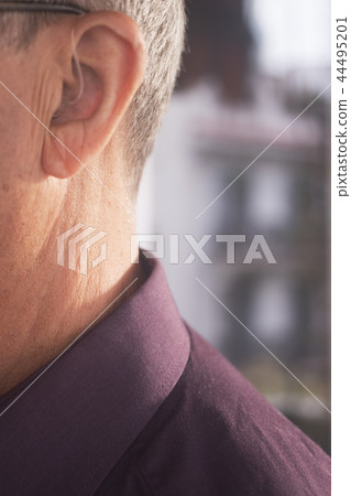 Deaf man hearing aid ear Deaf man hearing aid ear 44495201