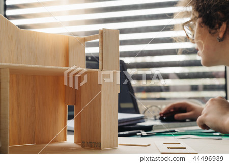 A woman architecture student working on models 44496989